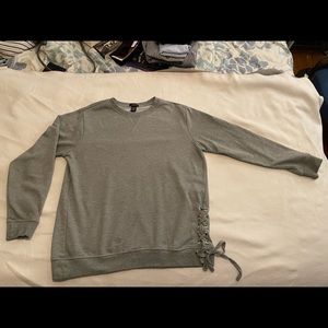 Gray sweater with lace-up detail